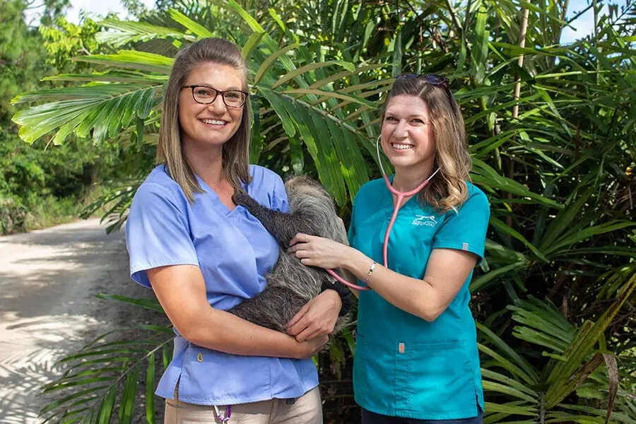 Kristi and Kaleigh with sloth