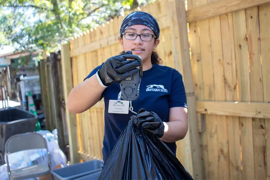 Sustainability intern weighs trash