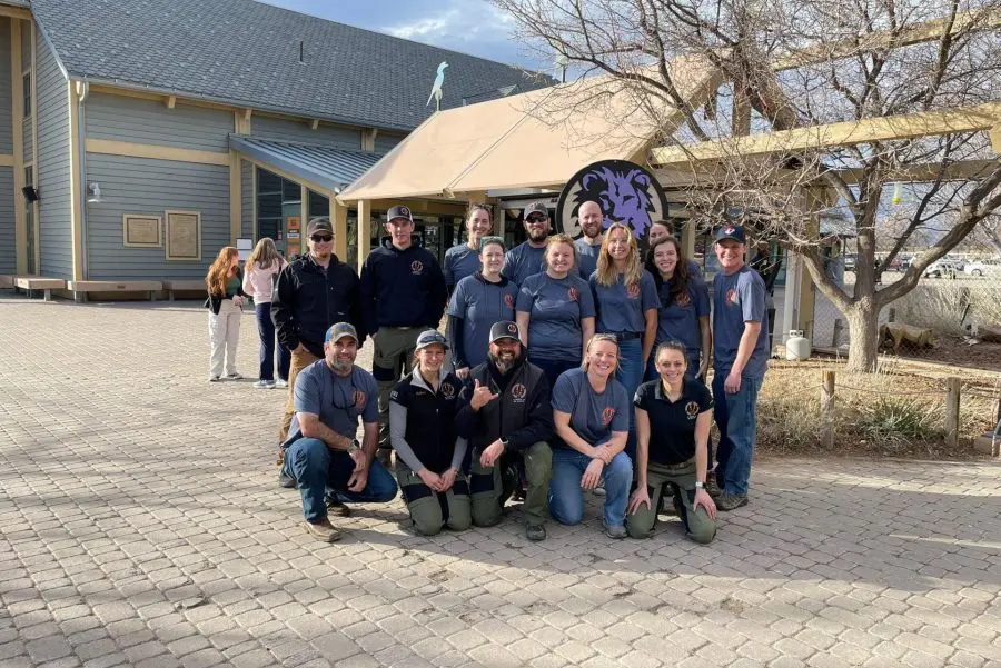 Brevard Zoo Africa keeper Morgan Thums poses with her graduating class at the Zoo Hoofstock Trim Program!