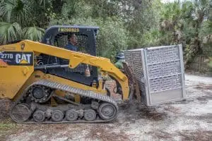 A loader lifts a secure carrier.