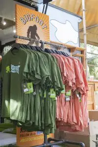 Rack of Bigfoot-themed t-shirts.
