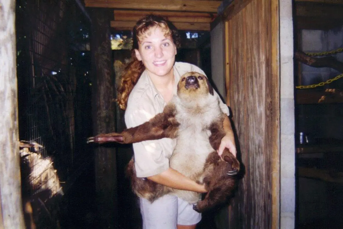 historic photo of brevard zoo keeper holding tootsie the sloth