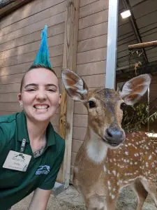 Shelby Orth with Peach the axis deer