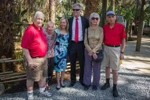 Group poses for photo during opening