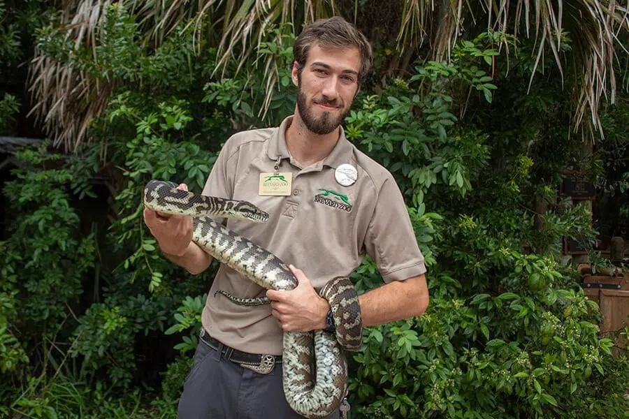 Logan with Louie the carpet python