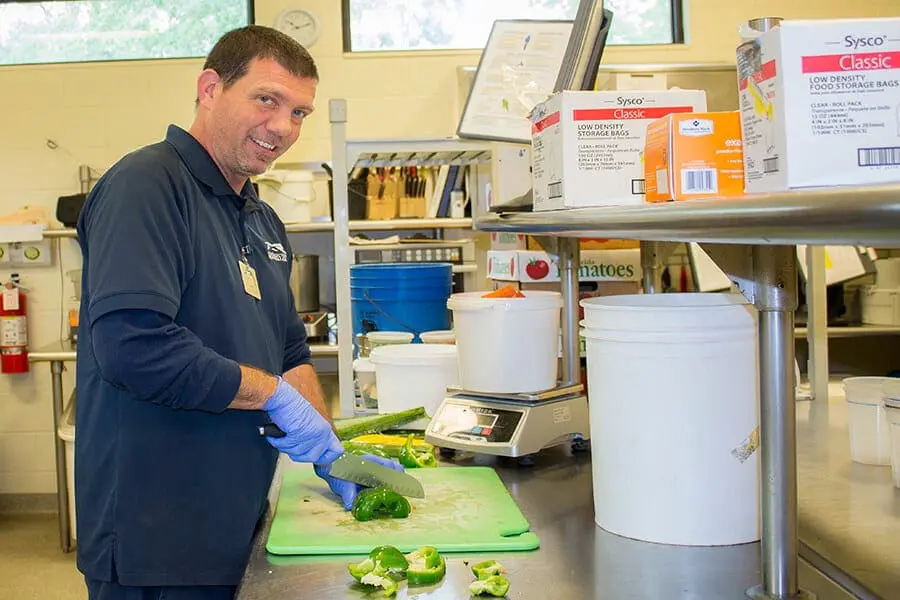 Matt chopping vegetables