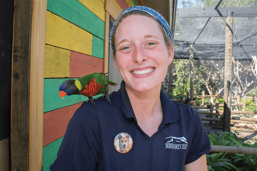 Michelle with Gus the rainbow lorikeet