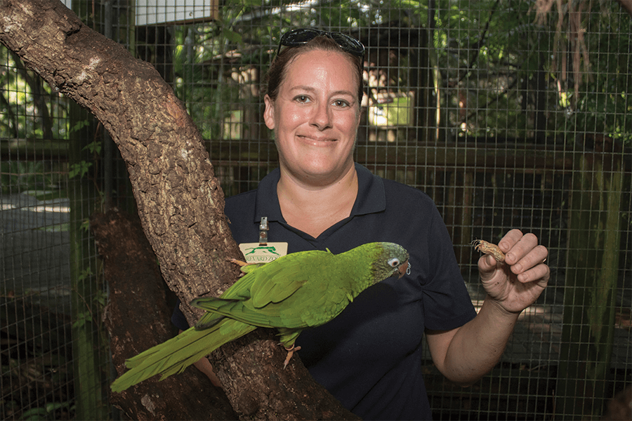 Nikki with Zippy the blue-crowned parakeet