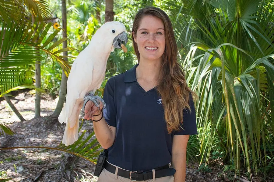 Sam with Goofy the salmon-crested cockatoo