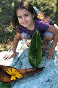 child making a nature boat