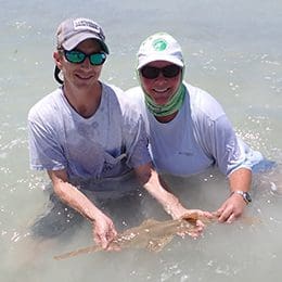 Adam Brame and Tonya Wiley with the first sawfish tagged in Tampa Bay credit Tonya Wiley