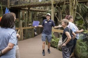 A group is led through Brevard Zoo's Rainforest area.