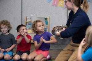 Preschoolers take a look at a snake.
