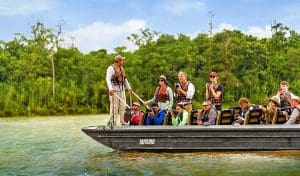Passengers on a boat doing a tour on the river along the Amazon jungle