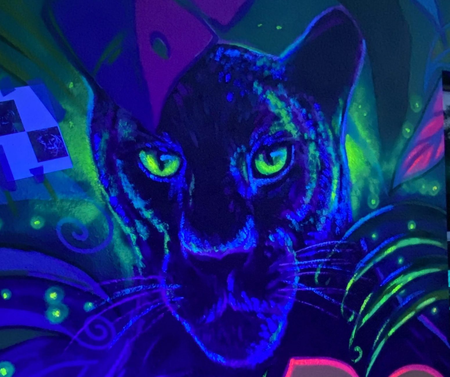 glow in the dark art of a panther by artist German Lemus