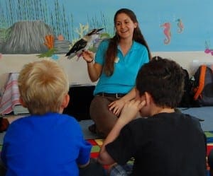 Educator presenting a kookaburra to class