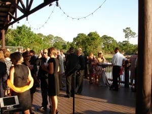 Guests gather for cocktail party on deck