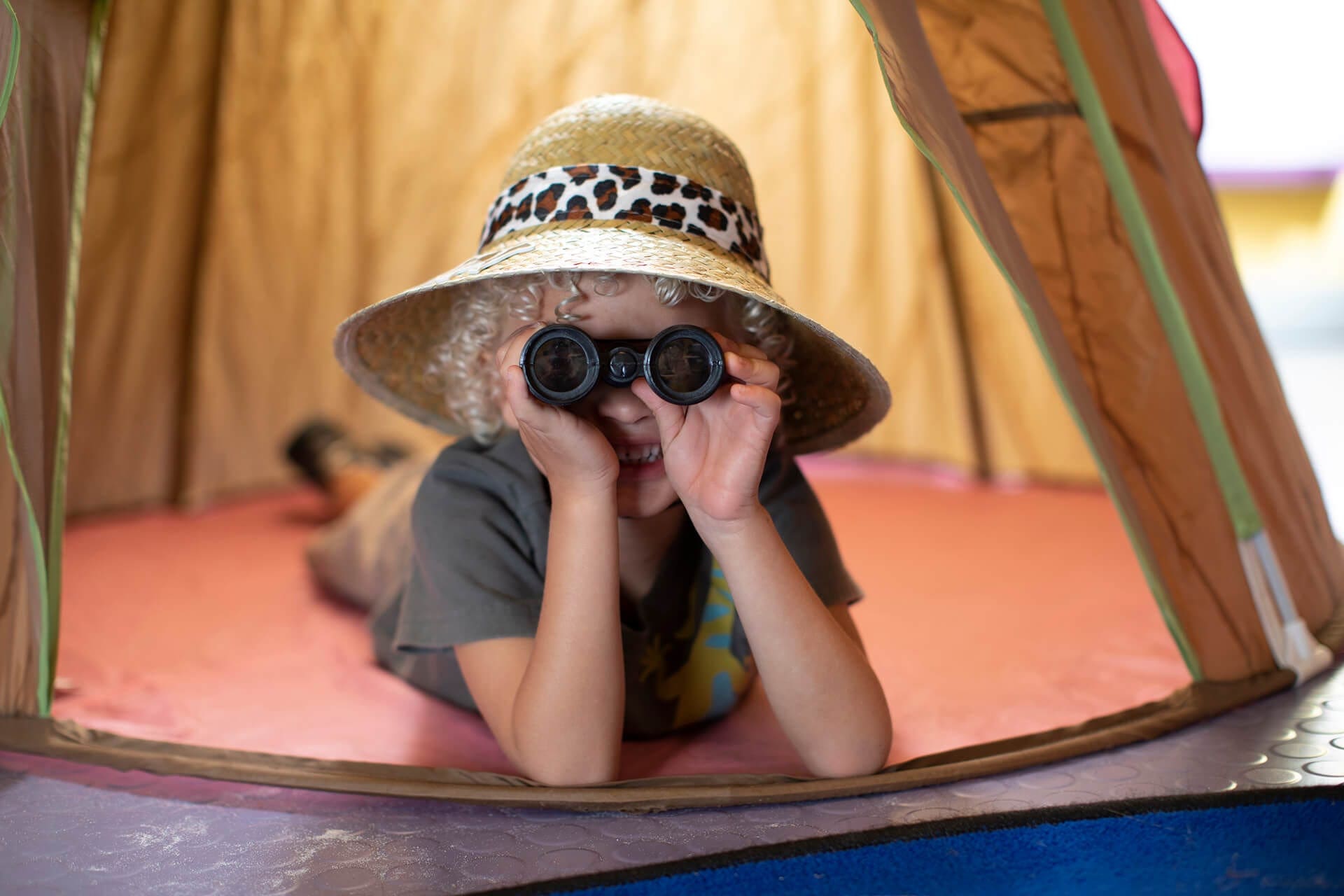 search header, boy with binoculars
