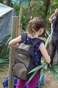 Girl wearing Family Nature Club backpack