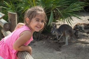 A girl smiles in the Kangaroo Walkabout